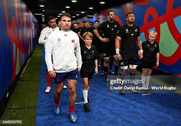 Antoine Dupont of France and Ardie Savea of New Zealand line up with teammates in the tunnel prior to the Rugby World Cup France 2023 Pool A match...