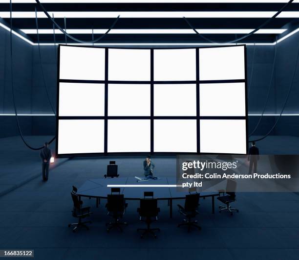 business people with screens in conference room - control room monitors stockfoto's en -beelden