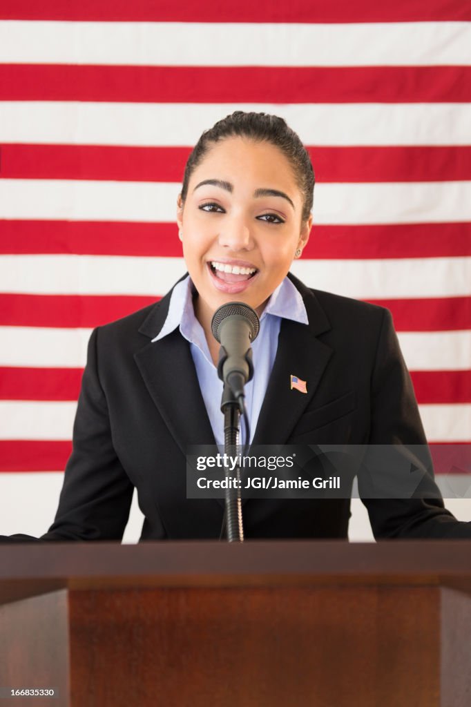 Hispanic woman giving speech