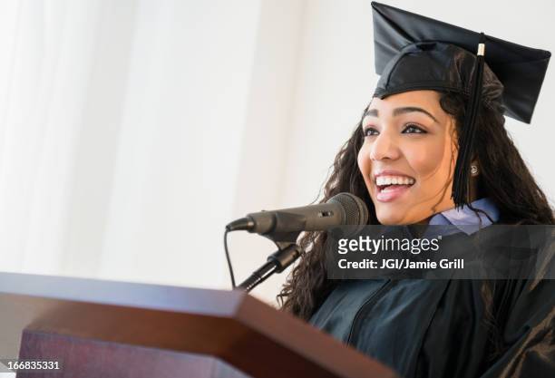 hispanic student giving speech at graduation - graduation speech stock pictures, royalty-free photos & images