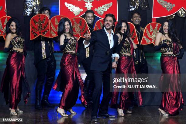 Bollywood actor Shah Rukh Khan performs a dance during an event to celebrate the success of his Indian Hindi-language action thriller film 'Jawan' in...
