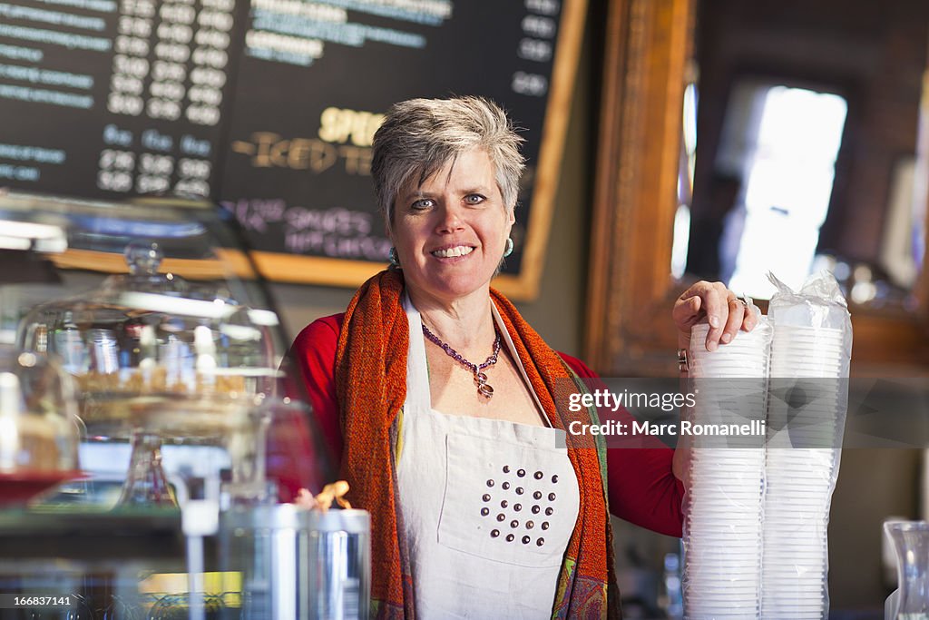 Caucasian woman working in coffee shop