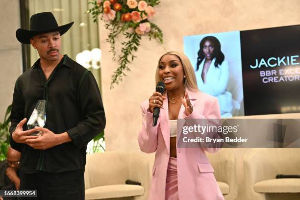 Sir John presents Jackie Aina with an award during the Black Beauty Roster Excellence Awards Luncheon, presented by Lashify, at NYFW: The Shows at...