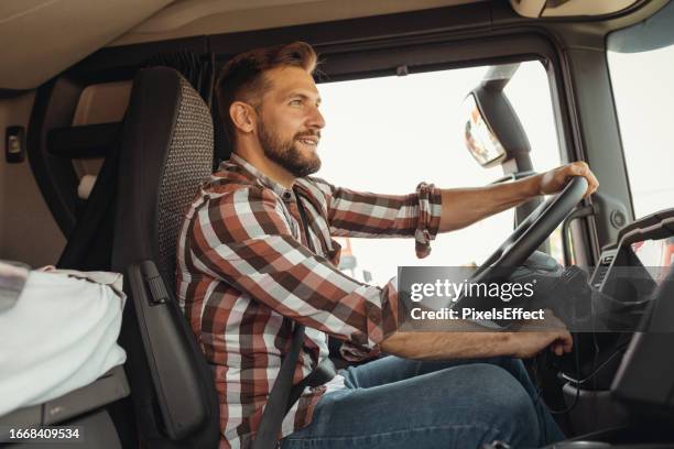 man trucker driving his truck - trucker stock pictures, royalty-free photos & images