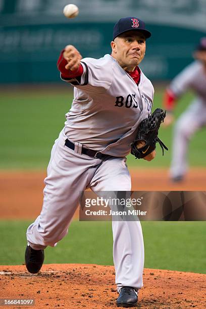 Starting pitcher Alfredo Aceves of the Boston Red Sox pitches during the first inning against the Cleveland Indians at Progressive Field on April 17,...
