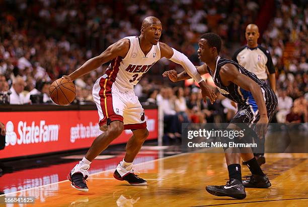 Ray Allen of the Miami Heat drives against Doron Lamb of the Orlando Magic during a game at American Airlines Arena on April 17, 2013 in Miami,...