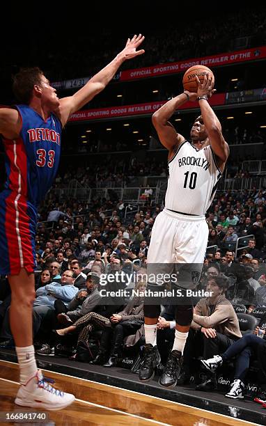 Keith Bogans of the Brooklyn Nets shoots against Jonas Jerebko of the Detroit Pistons on April 17, 2013 at the Barclays Center in the Brooklyn...