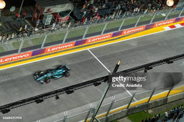 Drivers compete during the second practice session of The Formula 1 Singapore Grand Prix at the Marina Bay Street Circuit in Singapore, Singapore on...