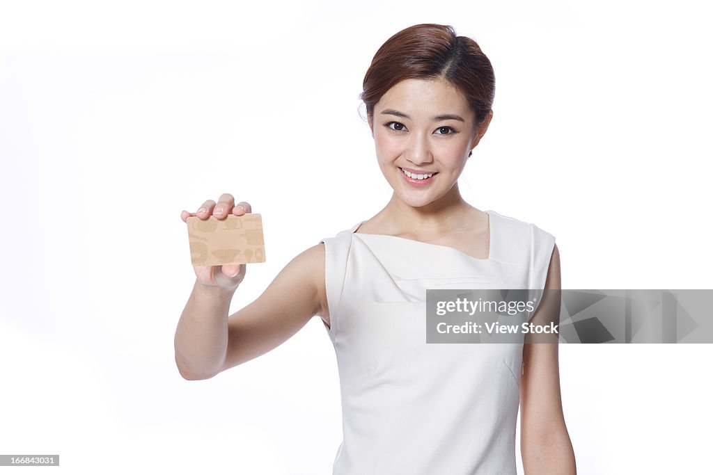 Young business lady holding credit card
