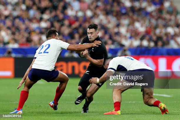 Will Jordan of New Zealand is tackled by Arthur Vincent and Jean-Baptiste Gros of France during the Rugby World Cup France 2023 Pool A match between...