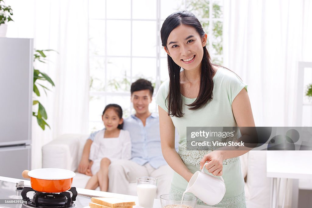 Family cooking in kitchen