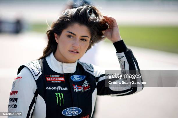 Hailie Deegan, driver of the Ford Performance Ford, walks the grid during qualifying for the NASCAR Craftsman Truck Series Kansas Lottery 200 at...