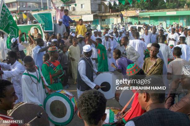 Muslims take part in a procession celebrating the birth anniversary of Islam's Prophet Mohammad in Sudan's eastern city of Gedaref on September 15,...