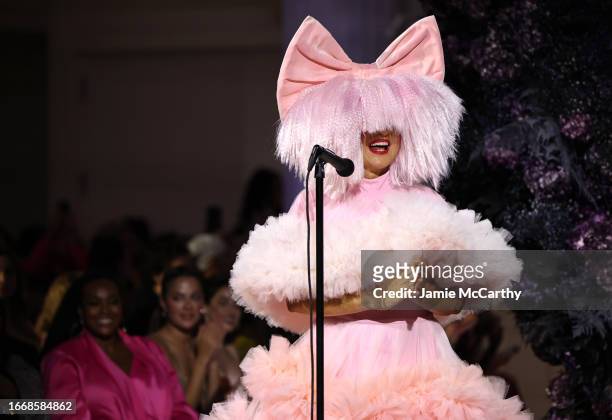 Sia performs on the runway during the Christian Siriano SS24 Runway Show at The Pierre Hotel on September 08, 2023 in New York City. (Photo by Jamie...