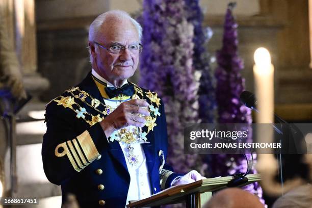 King Carl XVI Gustaf of Sweden gives a toast during the jubilee banquet in the Rikssalen at Stockholm Palace on the occasion of the 50th anniversary...