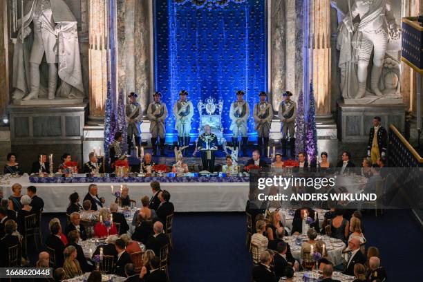 King Carl XVI Gustaf of Sweden makes a speech during the jubilee banquet in the Rikssalen at Stockholm Palace on the occasion of the 50th anniversary...