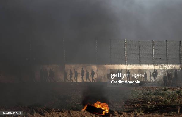 Smoke of burnt tires rises during the demonstrations of Palestinian people in support of Al-Aqsa Mosque and Palestinian prisoners against Israeli...