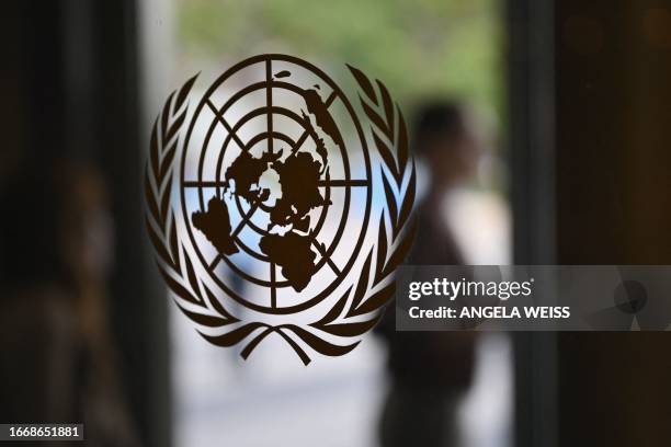 The UN logo is seen on a door at the United Nations headquarters ahead of the 78th session of the United Nations General Assembly in New York City on...