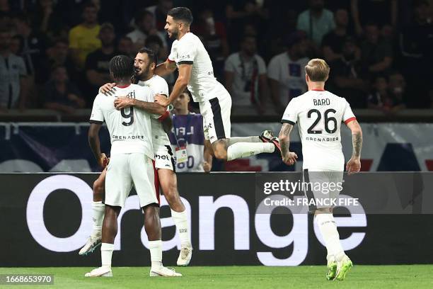 Nice's French forward Gaetan Laborde celebrates after scoring his team's second goal with Nice's Nigerian forward Terem Moffi who provided the assist...