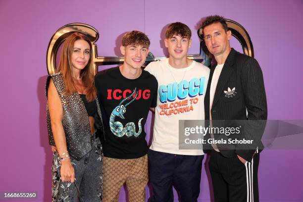 Sylwia Klose with Noah Klose,, Luan Klose and husband soccer player Miroslav Klose during the Gucci Munich flagship store opening cocktail 2023 on...