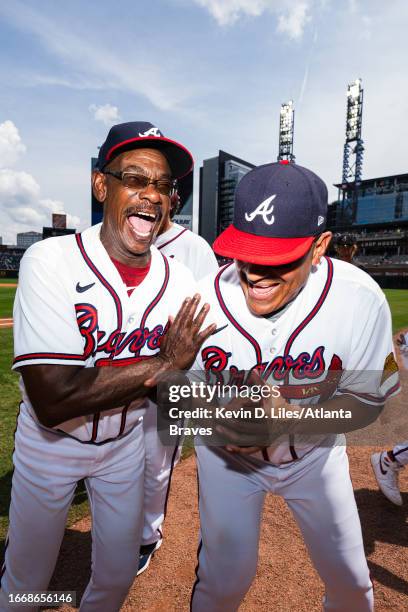 Ron Washington of the Atlanta Braves and Eddie Perez celebrate the win over the Los Angeles Angels at Truist Park on August 02, 2023 in Atlanta,...