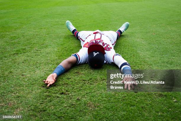 Michael Harris II of the Atlanta Braves stretches on the field before the game against the Los Angeles Angels at Truist Park on August 02, 2023 in...