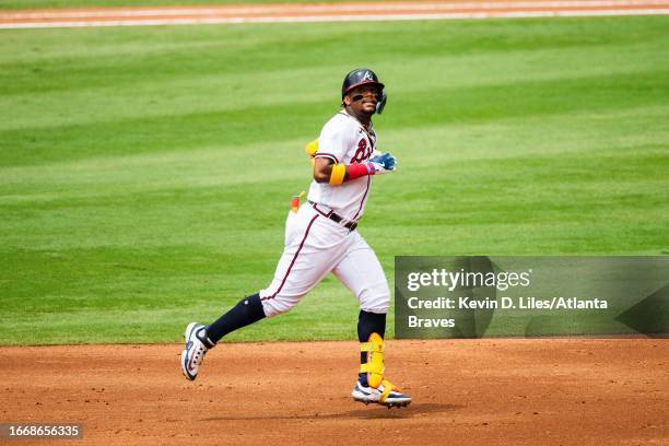 Ronald Acuna Jr. #13 of the Atlanta Braves hits a home run during the game against the Los Angeles Angels at Truist Park on August 02, 2023 in...