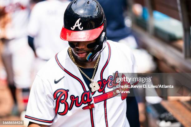 Ronald Acuna Jr. #13 of the Atlanta Braves walks into the dugout during the game against the Los Angeles Angels at Truist Park on August 02, 2023 in...
