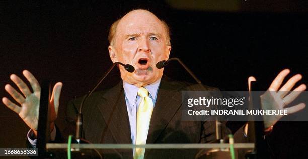 John F. Welch Jr., chairman of the board and CEO of US-based General Electric Co. , gestures as he speaks after inaugurating the company's largest...
