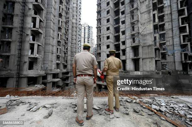 Police officers at Construction site where a lift fell from a high rise building at under-construction residential township killing Four people and...