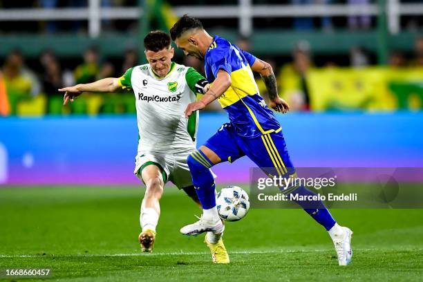 Nicolas Tripichio of Defensa y Justicia competes for the ball with Lucas Janson of Boca Juniors during a match between Defensa y Justicia and Boca...