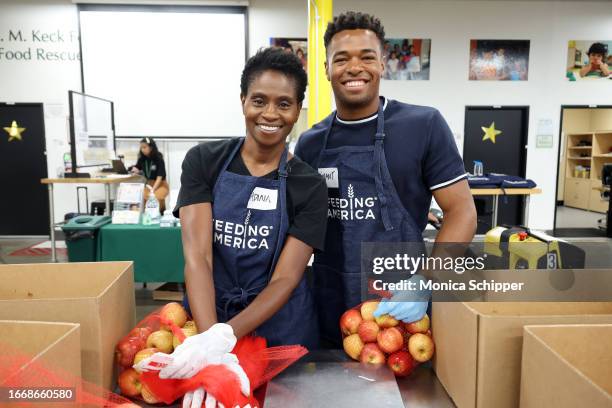 Adina Porter and Grant Hall volunteer as Feeding America hosts Hunger Action Day at the Los Angeles Regional Food Bank on September 15, 2023 in Los...