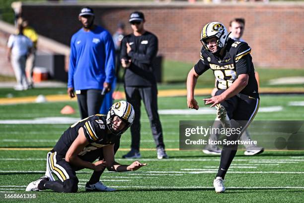 Missouri Tigers place kicker Harrison Mevis takes practice kicks form the hold of Missouri Tigers place kicker Luke Bauer during a non conference...