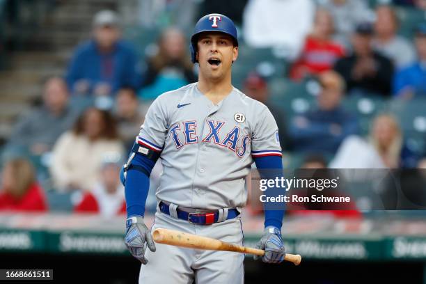 Nathaniel Lowe of the Texas Rangers reacts after striking out against Lucas Giolito of the Cleveland Guardians during the first inning at Progressive...