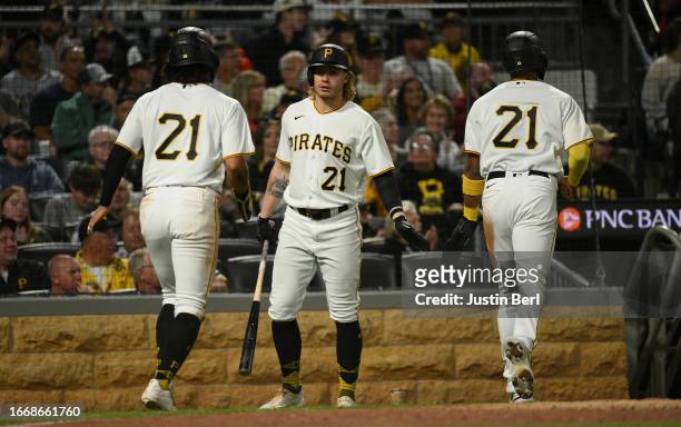 Ji Hwan Bae of the Pittsburgh Pirates and Joshua Palacios are met by Jack Suwinski after coming around to score on a two run RBI single by Ke'Bryan...