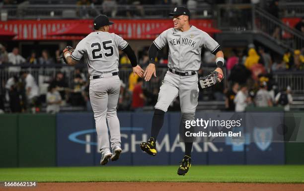 Aaron Judge of the New York Yankees celebrates with Gleyber Torres after the final out in a 7-5 win over the Pittsburgh Pirates during the game at...