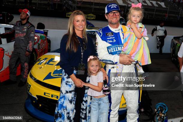 Dale Earnhardt Jr poses for a picture with wife Amy and daughters Isla and Nicole prior to the running of the NASCAR Xfinity Series Playoff Food City...