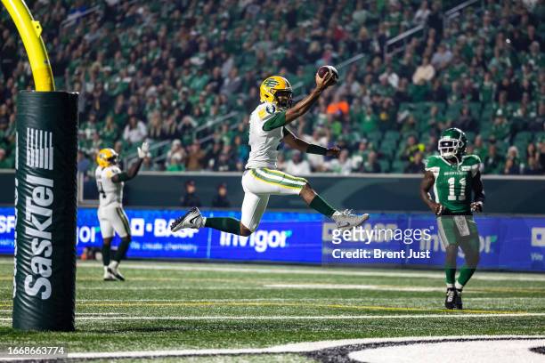 Tre Ford of the Edmonton Elks leaps across the goal line for the winning touchdown against the Saskatchewan Roughriders at Mosaic Stadium on...