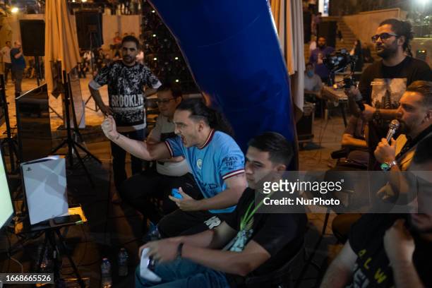 An Iranian gamer reacts after winning a match during Iran's FIFA 23 Esports competitions at Adrenaline Park in northwestern Tehran, September 15,...