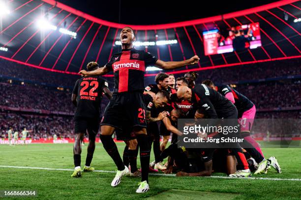 Amine Adli and his teammates of Bayer Leverkusen react after their teams second goal during the Bundesliga match between FC Bayern München and Bayer...