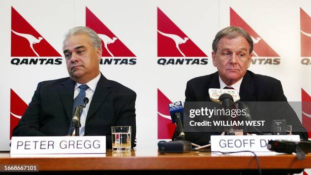 Qantas chief executive Geoff Dixon and chief financial officer Peter Gregg ponder on a question at a press conference where Qantas announced they...