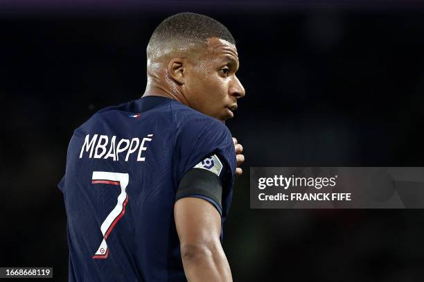 Paris Saint-Germain's French forward Kylian Mbappe looks on during the French L1 football match between Paris Saint-Germain and OGC Nice at The Parc...