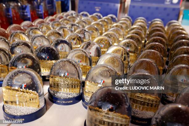 Snow globes are seen at the gift shop of the Elysee Palace during the 'European Heritage Days' in Paris, on September 16, 2023.