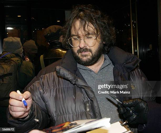 Director Peter Jackson signs autographs outside the Regency Hotel after a press juncket for "Lord of the Rings: The Two Towers" December 2, 2002 in...