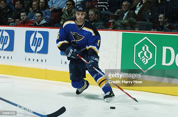 Defenseman Barrett Jackman of the St. Louis Blues plays the puck against the Montreal Canadiens during the NHL game on November 5, 2002 at The Molson...