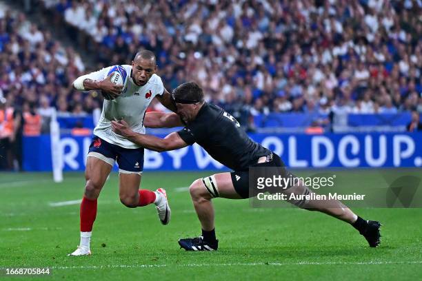 Scott Barrett of New Zealand tackles Gael Fickou of France during the Rugby World Cup France 2023 match between France and New Zealand at Stade de...