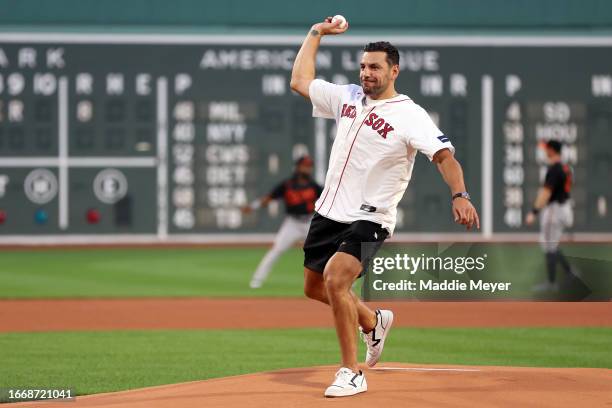 Milan Lucic of the Boston Bruins throws out the ceremonial first pitch before the game between the Boston Red Sox and the Baltimore Orioles at Fenway...