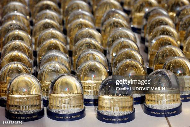 Snow globes are seen at the gift shop of the Elysee Palace during the 'European Heritage Days' in Paris, on September 16, 2023.