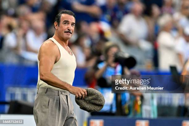 Jean Dujardin performs during the opening ceremony before the Rugby World Cup France 2023 match between France and New Zealand at Stade de France on...