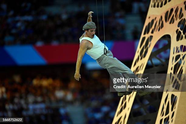 Jean Dujardin performs during the opening ceremony before the Rugby World Cup France 2023 match between France and New Zealand at Stade de France on...